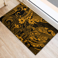 Gold and black rubber doormat with Polynesian swirl, tiki, and flower motifs