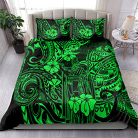 Green Polynesian patterned bedding set with matching pillowcases on a bed