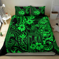 Green Polynesian patterned duvet with two matching pillows on a bed