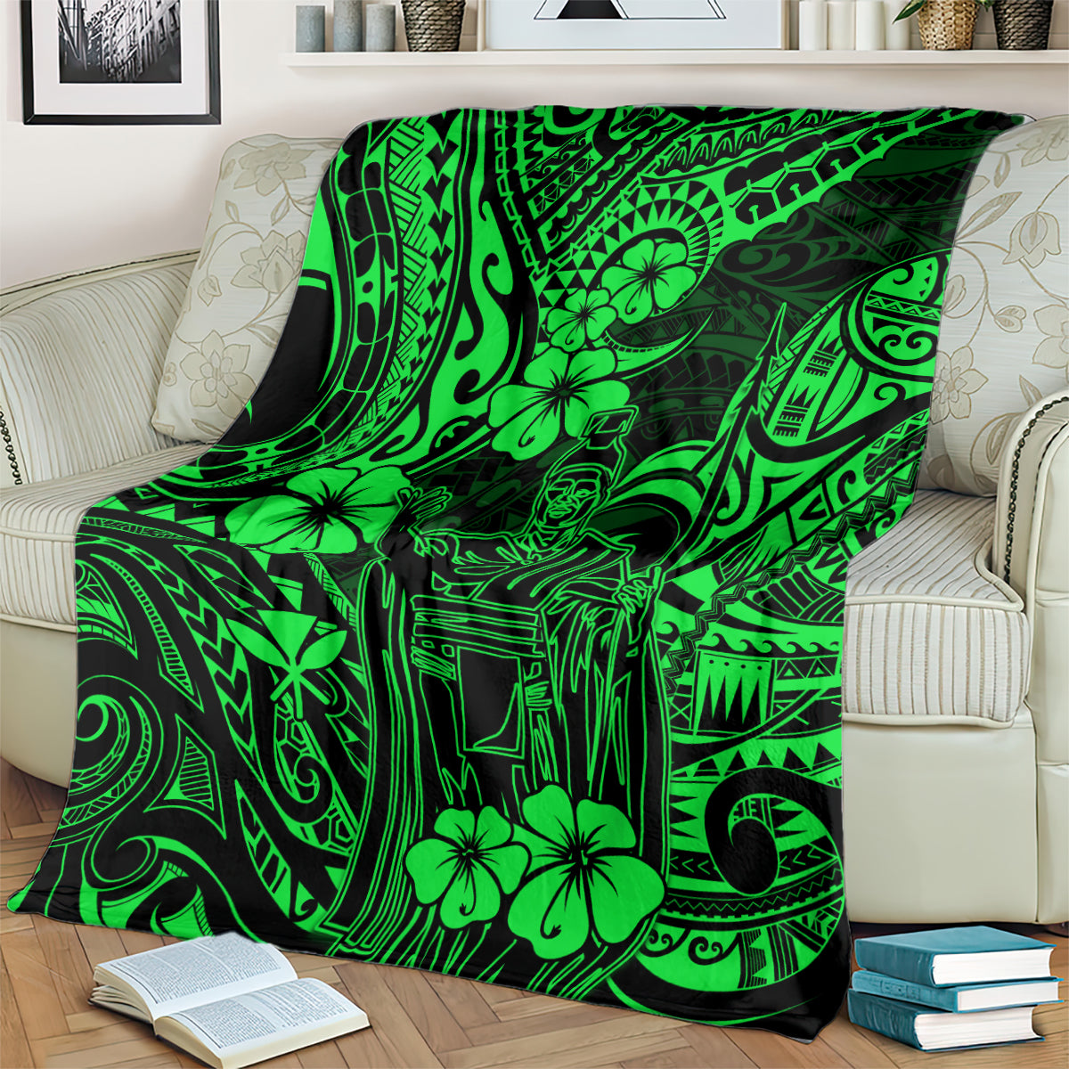Green Polynesian pattern blanket spread over an upholstered sofa and pillows.