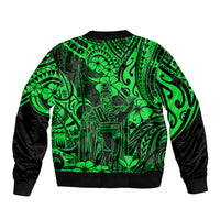 Green bomber jacket with central Polynesian-style artwork and black ribbed hem