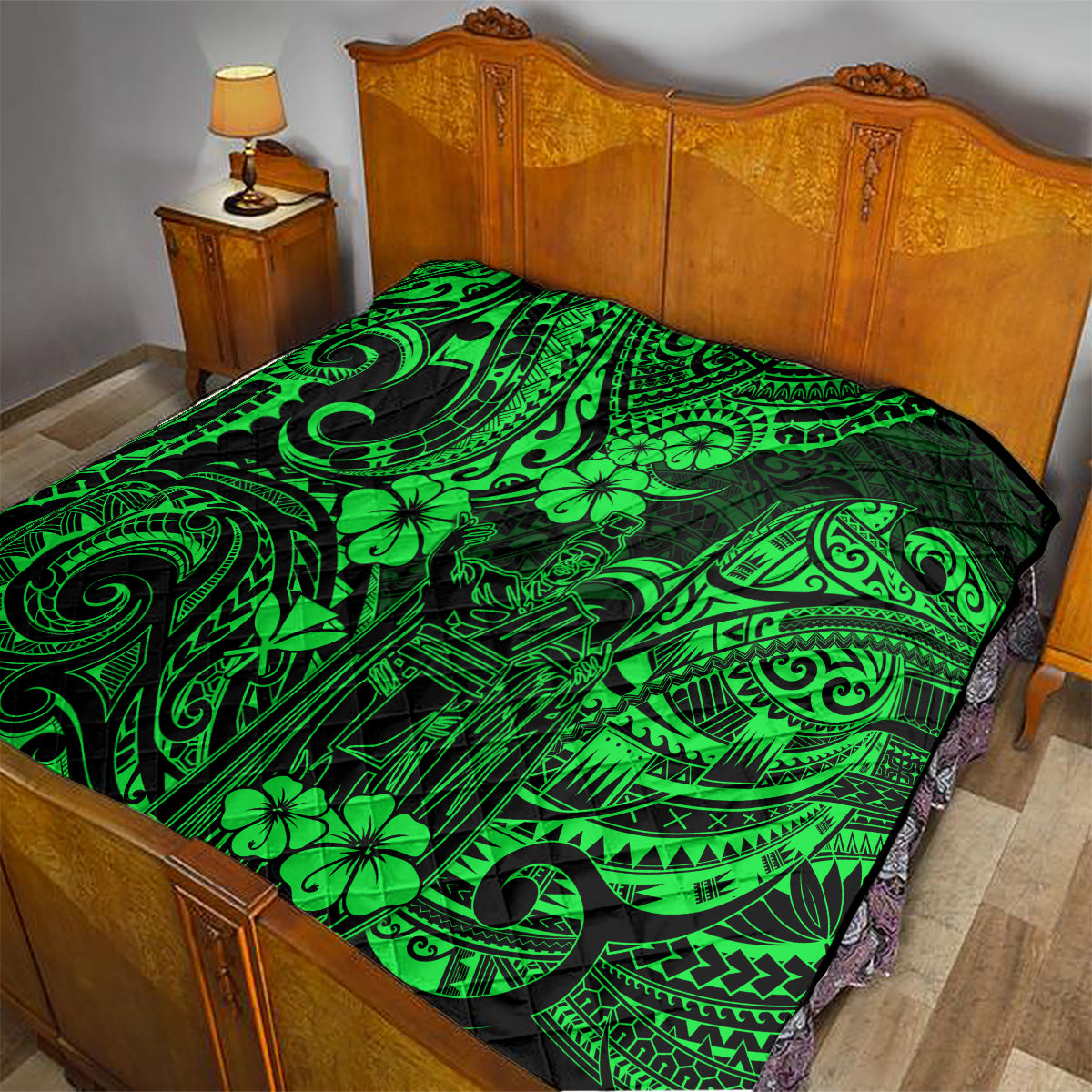 Green Polynesian pattern quilt on a bed with matching black-and-green design