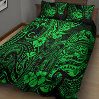 Green quilt bed set with bold Polynesian motifs, black border, and two pillowcases
