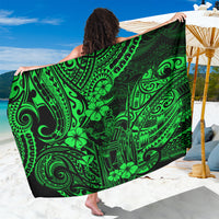 Green polynesian-pattern sarong with decorative tribal motifs, draped and tied at side
