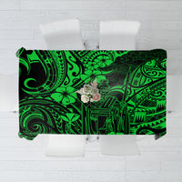 Green polynesian tablecloth with bold geometric and floral pattern, rectangular overhang