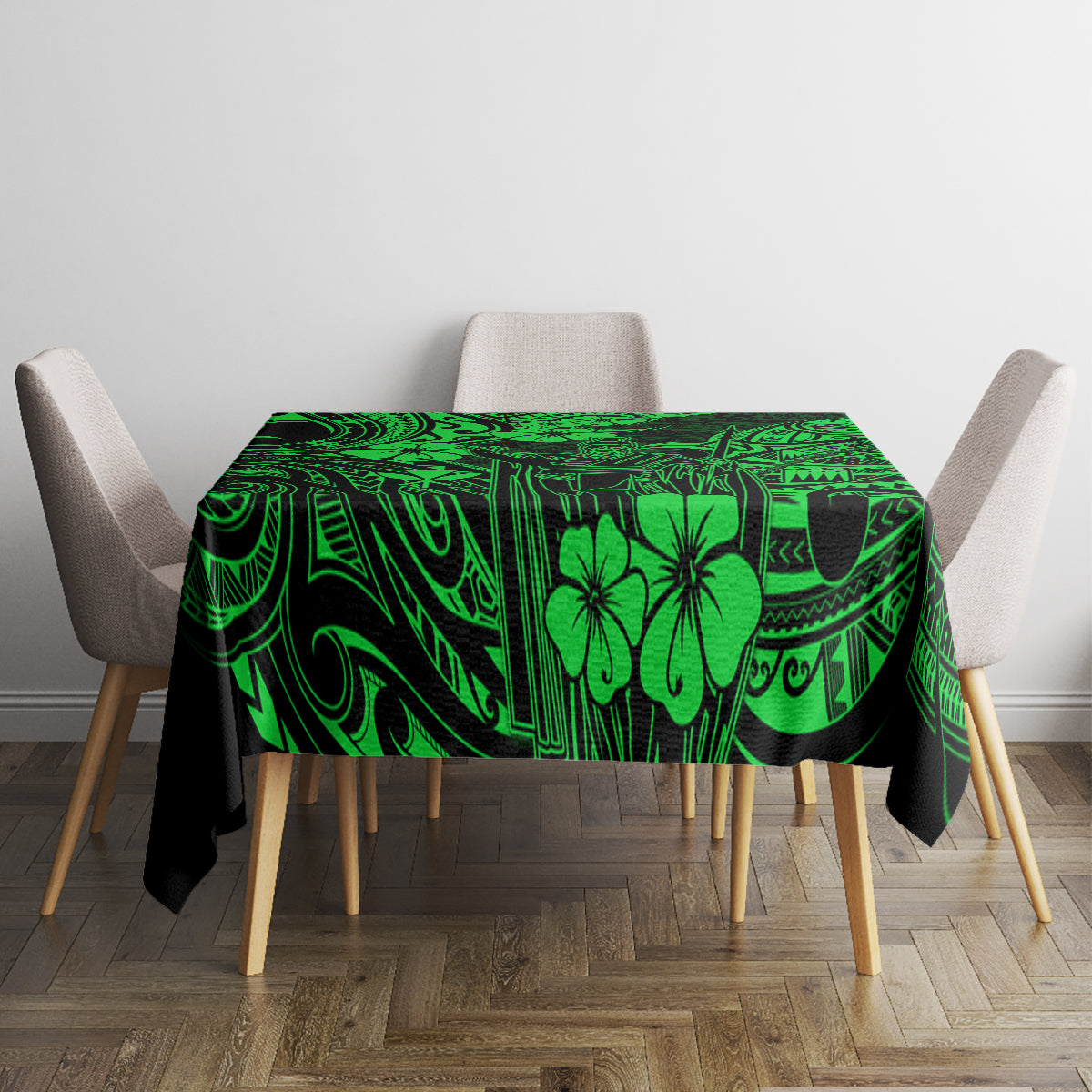 Green polynesian tablecloth laid on table, dark swirls and island flower motifs