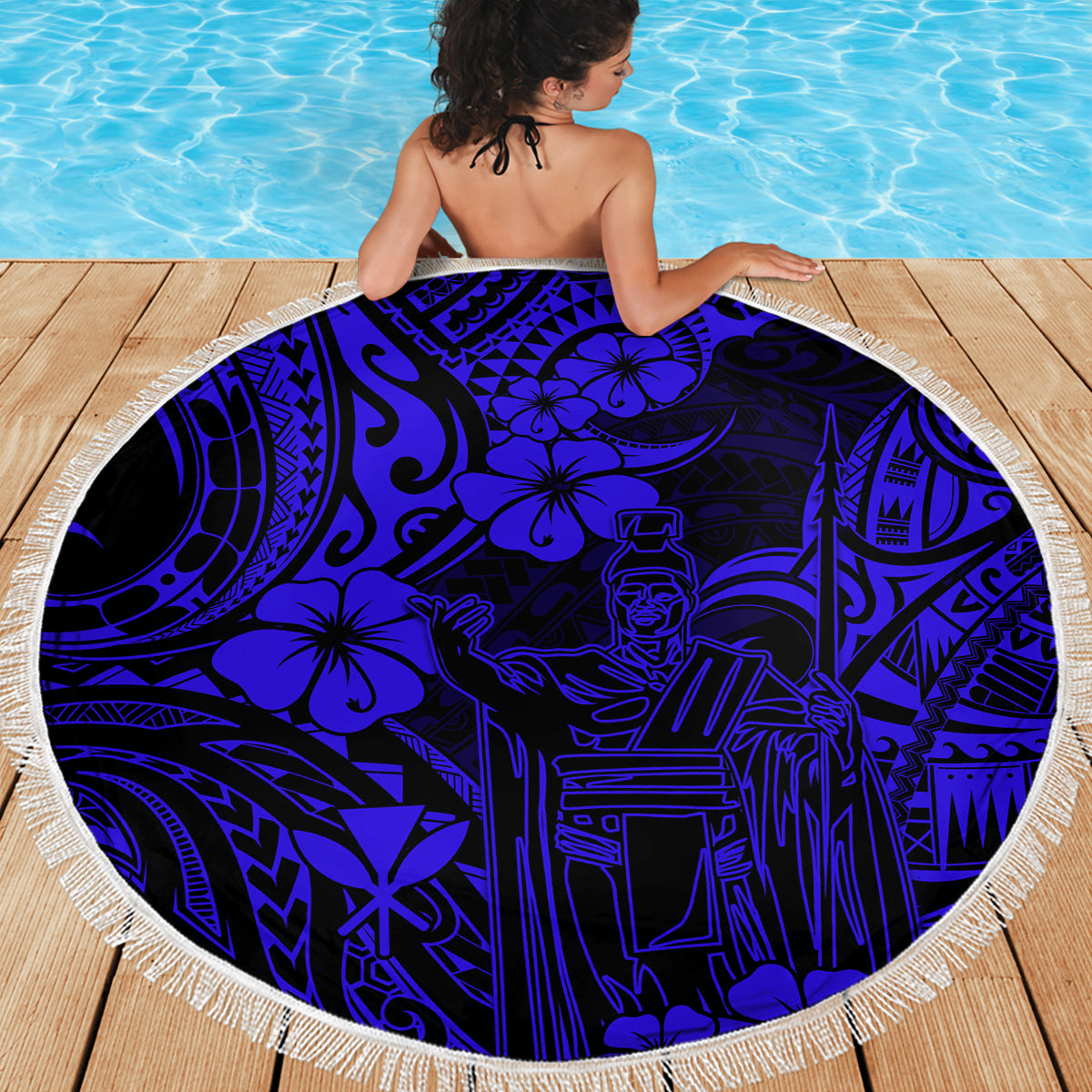 Navy blue round beach blanket with Polynesian pattern and white fringe edge