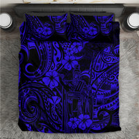 Navy and blue Polynesian patterned bedding comforter with floral and geometric motifs