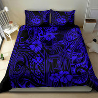 Navy and blue Polynesian patterned bedding set with comforter and pillow shams, bold motifs