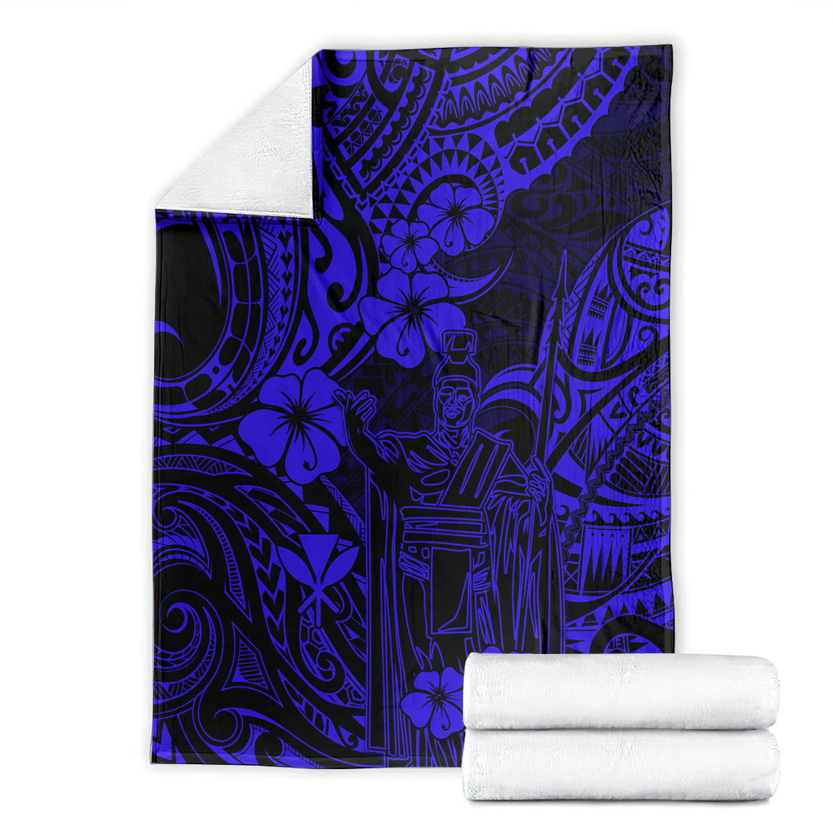 Navy blue patterned blanket with floral and tiki motifs, shown with folded white towels