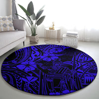 Round navy blue Polynesian pattern carpet with large central figure graphic
