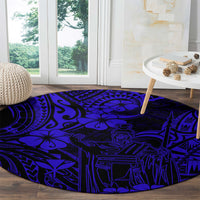 Navy blue round carpet with Polynesian line art figures and flower motifs