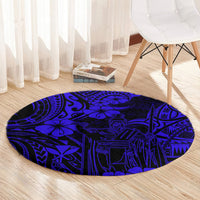 Round navy blue carpet with bold Polynesian pattern in dark blue and navy