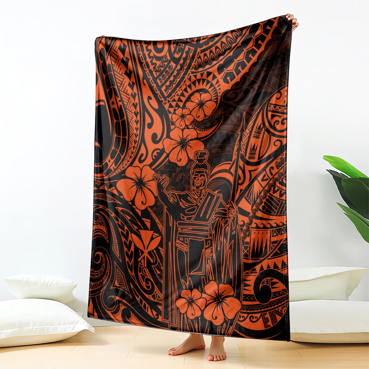 Orange and black Polynesian pattern blanket with floral motifs and central king figure