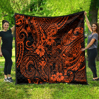 Orange and black Polynesian quilt draped outside, featuring tiki swirls and flowers