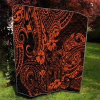 Orange and black Polynesian quilt with tiki figures, spirals, and hibiscus-like flowers