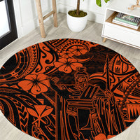 Round orange and black Polynesian patterned carpet with stylized figures and borders