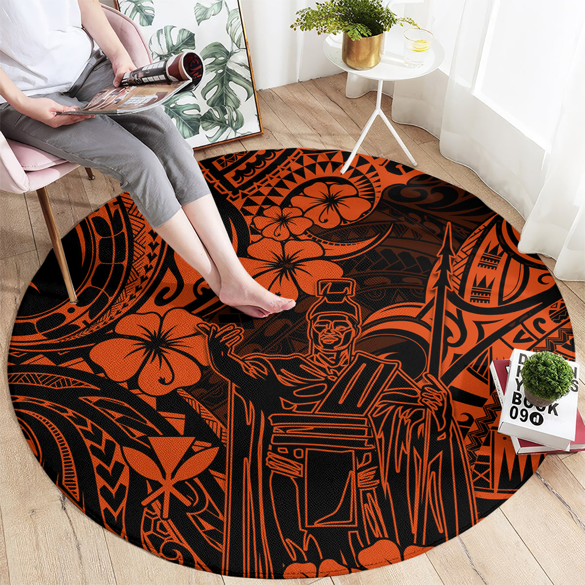 Round orange and black Polynesian patterned area rug with people, flowers, and tribal lines