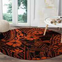 Round orange and black Polynesian patterned carpet with tiki figure artwork and zigzag details