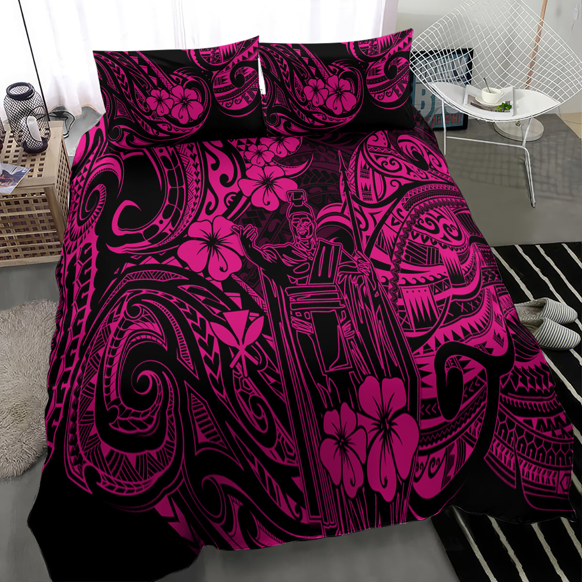 Pink and black Polynesian pattern bedding set draped over bed, full view
