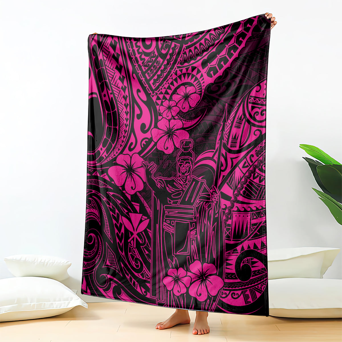 Pink and black Polynesian-pattern blanket with floral and king motif, draped