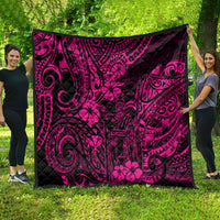 Pink Polynesian quilt spread out outdoors, featuring dark swirl and flower motifs