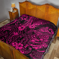 Pink Polynesian quilt laid on a bed, showing dark swirls and tropical flower shapes