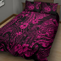 Pink and black quilt and pillow shams with bold swirls, masks, and hibiscus motifs.