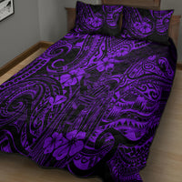 Purple and black Polynesian-pattern quilt bed set with matching pillow covers, spread on bed