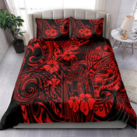 Red Polynesian patterned comforter with two matching pillows on bed