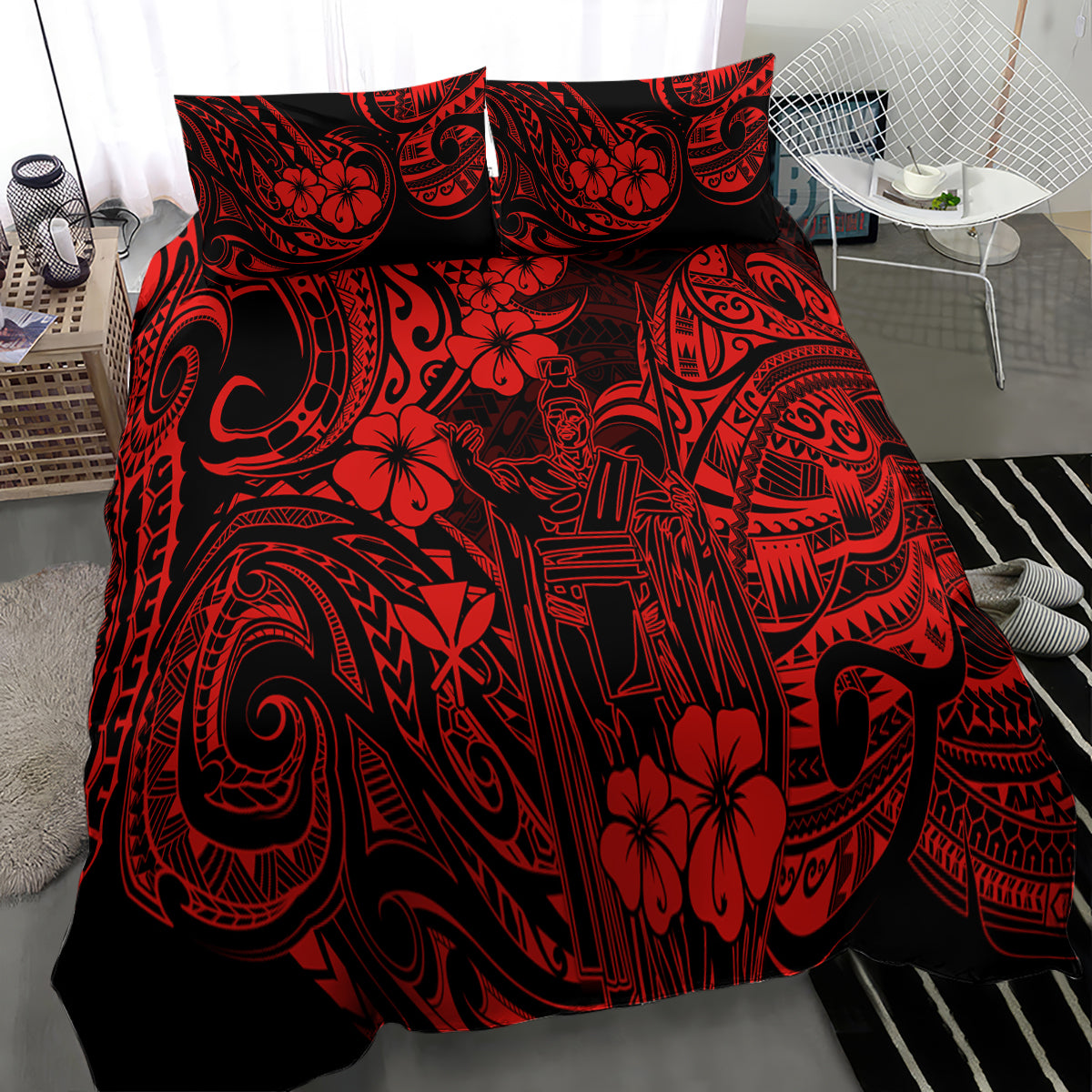 Red Polynesian patterned comforter with two matching pillows, angled view