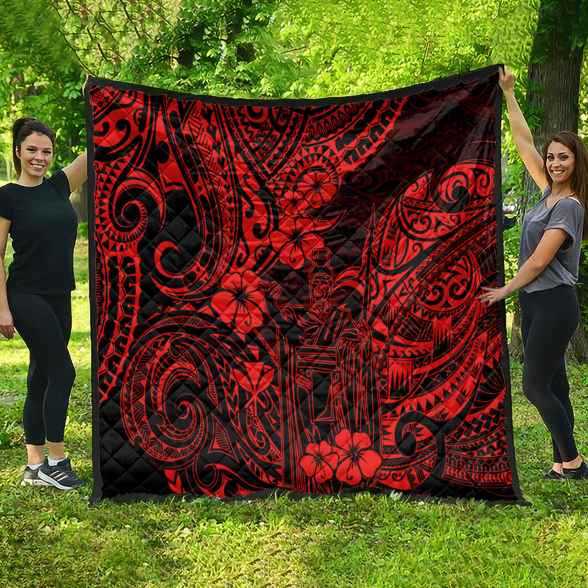 Red and black Polynesian pattern quilt with floral and tribal swirl designs