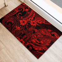 Rectangular red and black Polynesian swirl rubber doormat with textured surface
