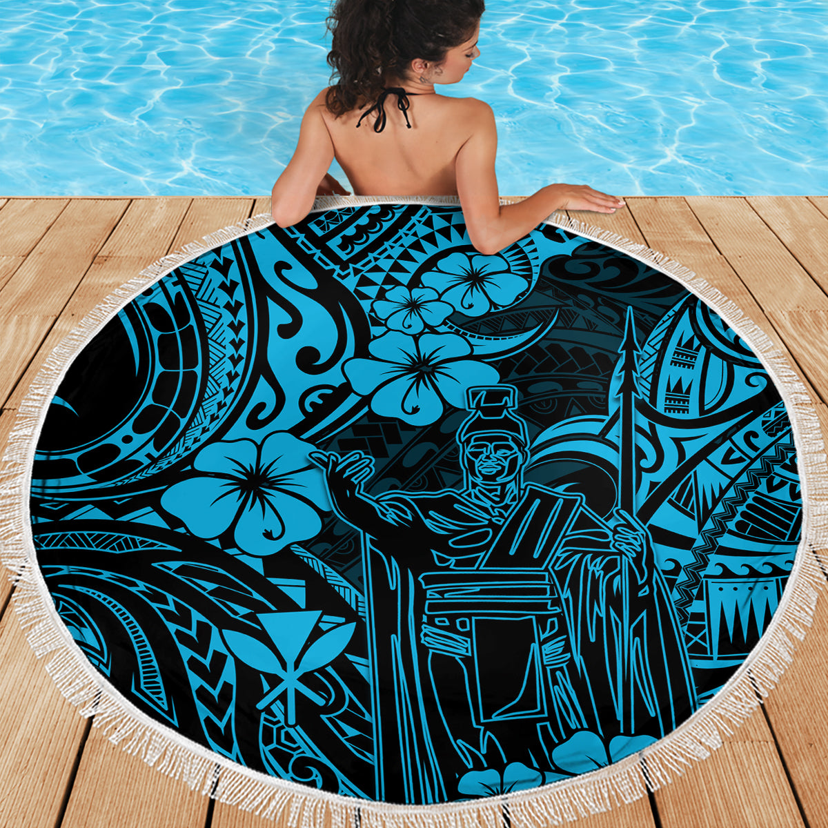 Round beach blanket with sky-blue Polynesian pattern and white fringed edge, laid flat