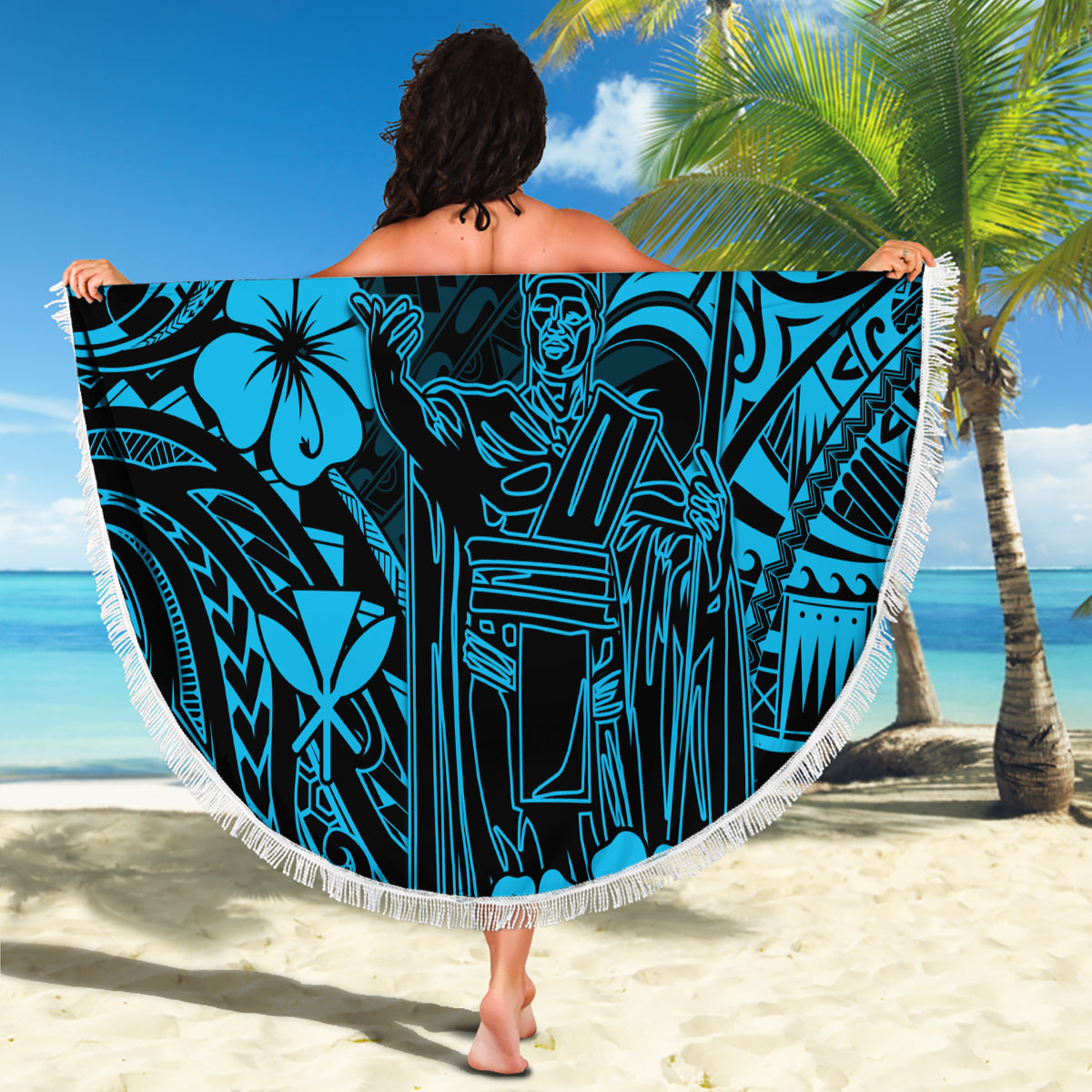 Round beach blanket with sky-blue Polynesian pattern and white fringed edge, held up