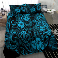 Polynesian patterned bedding set comforter with blue and black tiki motifs and flowers