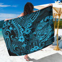Sky blue and dark teal patterned Polynesian sarong, shown draped and extended