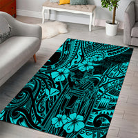 Turquoise polynesian area rug featuring bold tribal symbols and floral shapes