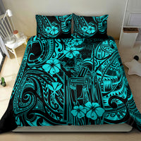 Turquoise and black Polynesian tribal patterned quilt with matching pillows