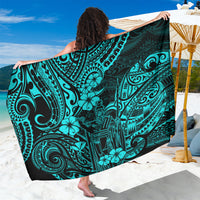 Turquoise polynesian-pattern sarong with dark swirls and hibiscus flowers