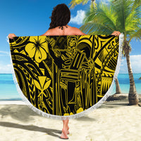 Round beach blanket with yellow and black Polynesian pattern and white fringe, held open.
