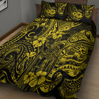 Yellow and black Polynesian-pattern quilt bed set, quilt and pillow shams on bed
