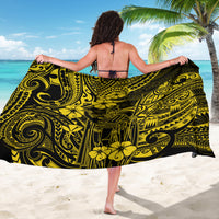 Yellow and black polynesian-pattern sarong with floral and swirl motifs, waist-worn