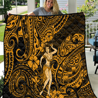 Gold and black Polynesian hula girl quilt with swirling pattern, shown draped over a person