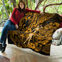 Gold and black Polynesian hula girl quilt draped on a bench with swirling and floral accents