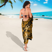 Gold and black hula girl sarong tied at waist, back drape