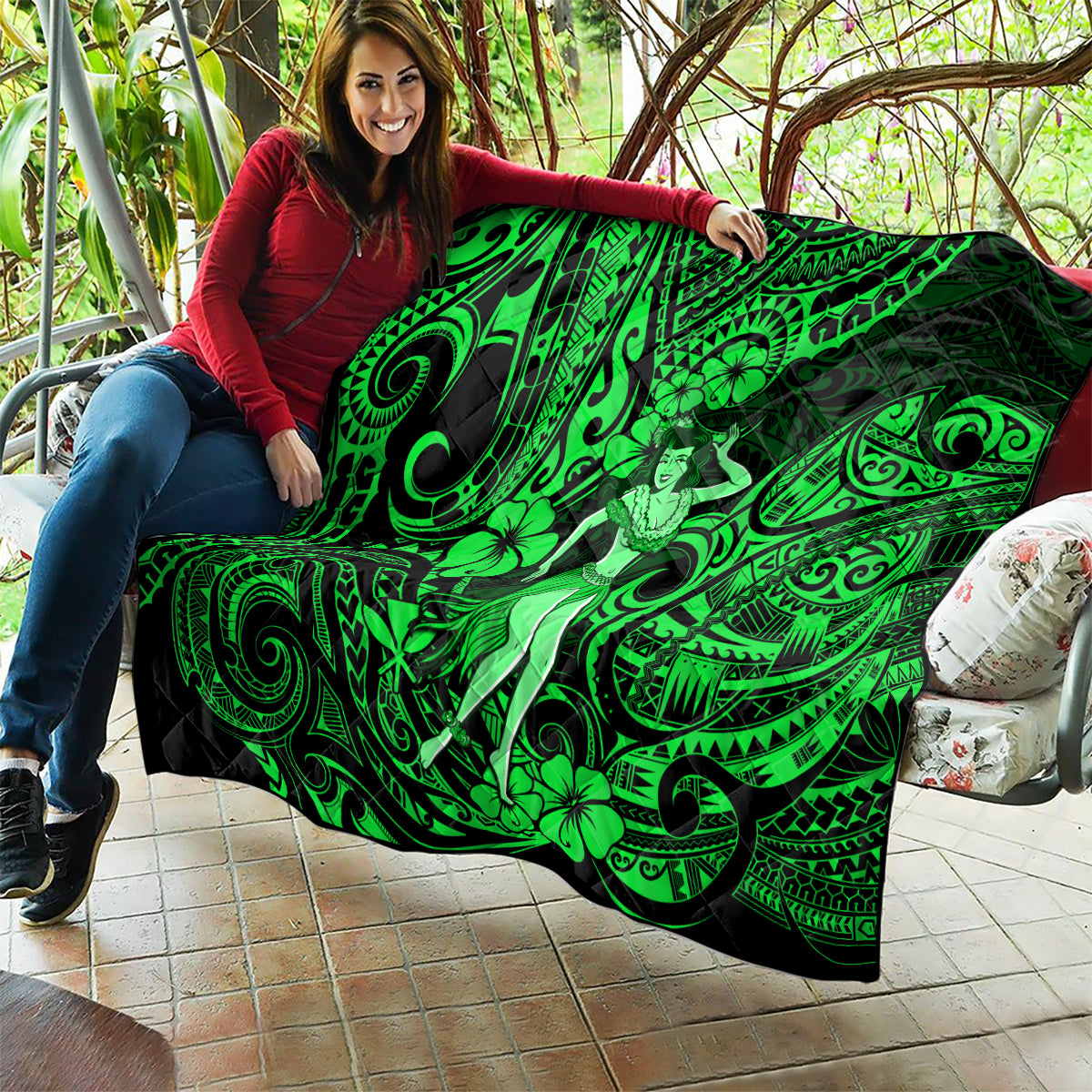 Green Polynesian hula girl quilt draped over shoulders with swirling tribal and floral motifs