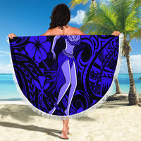 Round navy beach blanket with hula girl graphic, fringe trim and Polynesian pattern