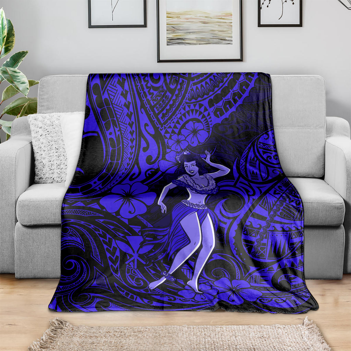 Navy blue Polynesian hula girl blanket draped over a gray sofa
