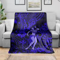 Navy blue Polynesian hula girl blanket draped over a gray sofa